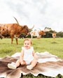 Another little cutie celebrating their first birthday with our longhorns. Photo credit: Kaycee Clicks Photography